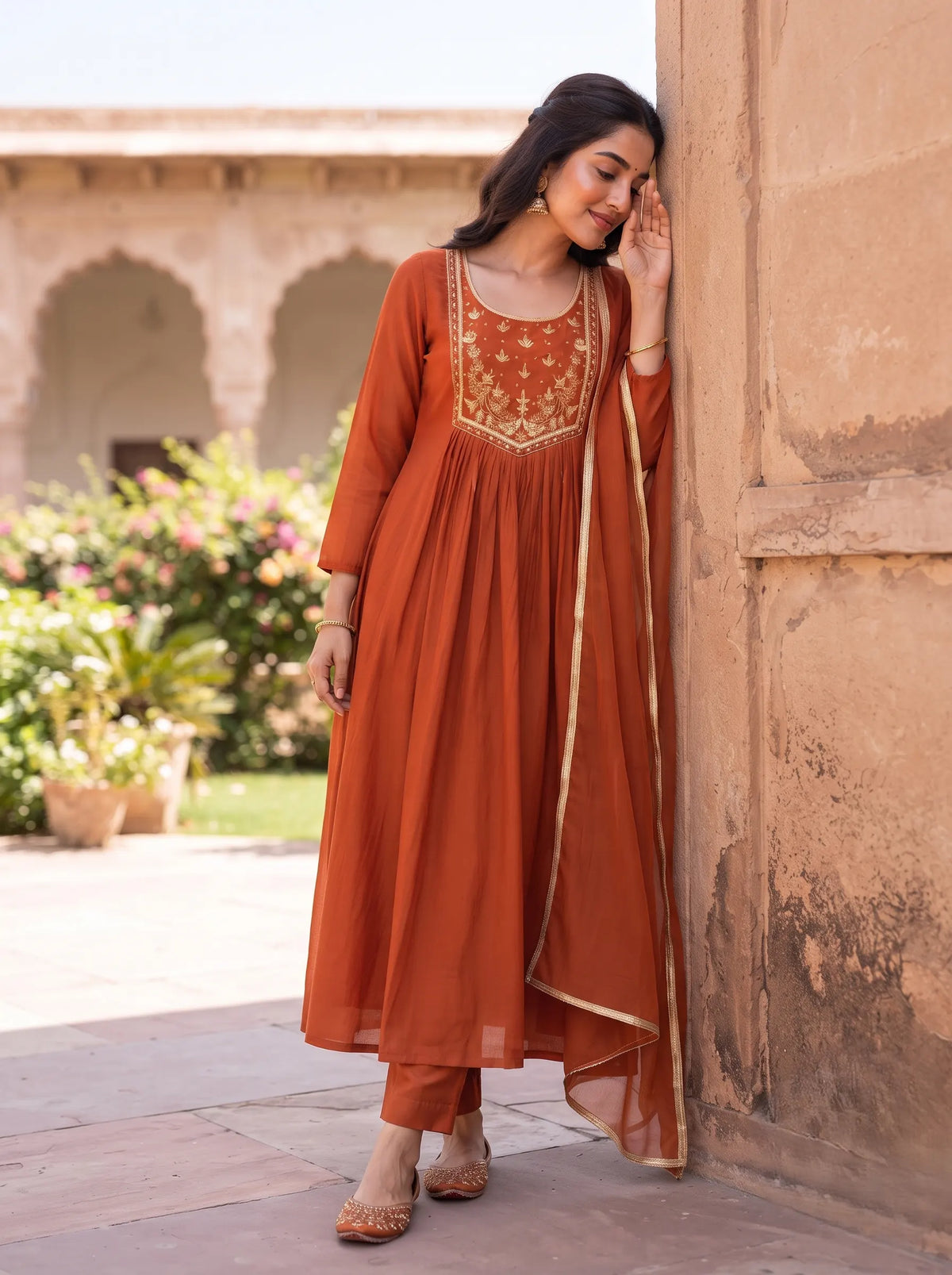 VIBRANT RUST ORANGE ANARKALI SUIT WITH HEAVY GOLD YOKE EMBROIDERY