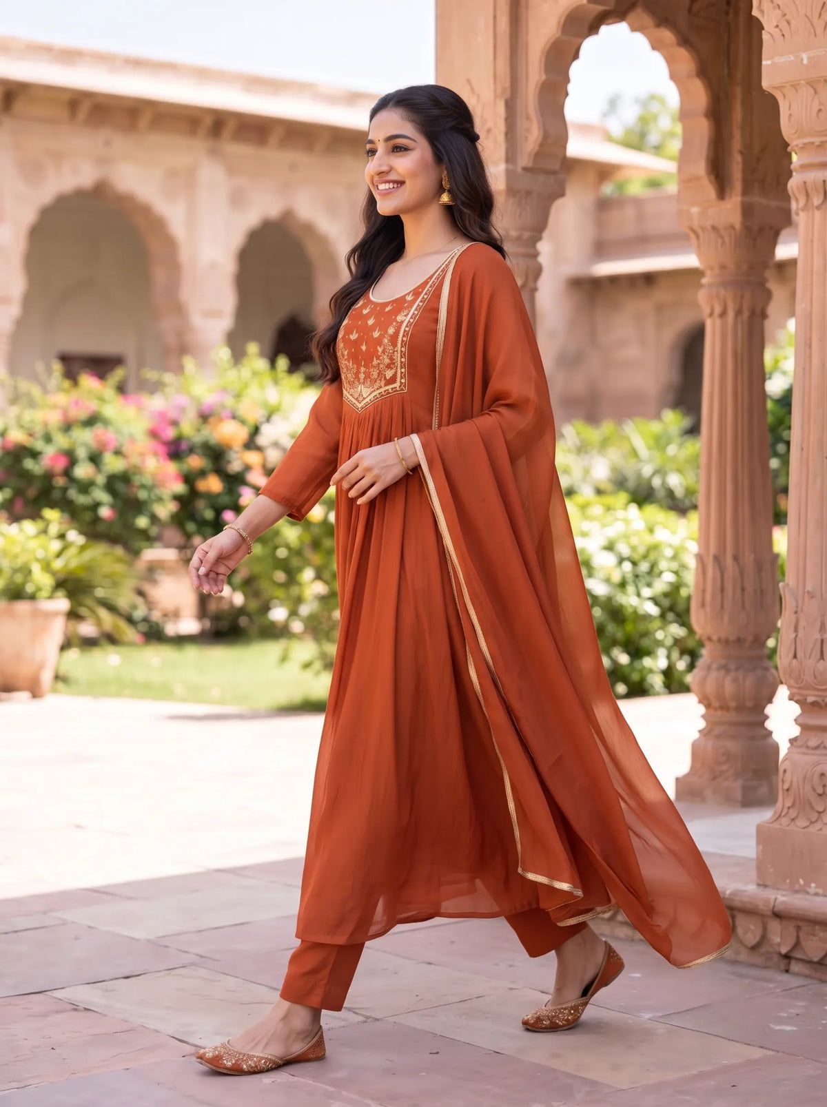 VIBRANT RUST ORANGE ANARKALI SUIT WITH HEAVY GOLD YOKE EMBROIDERY