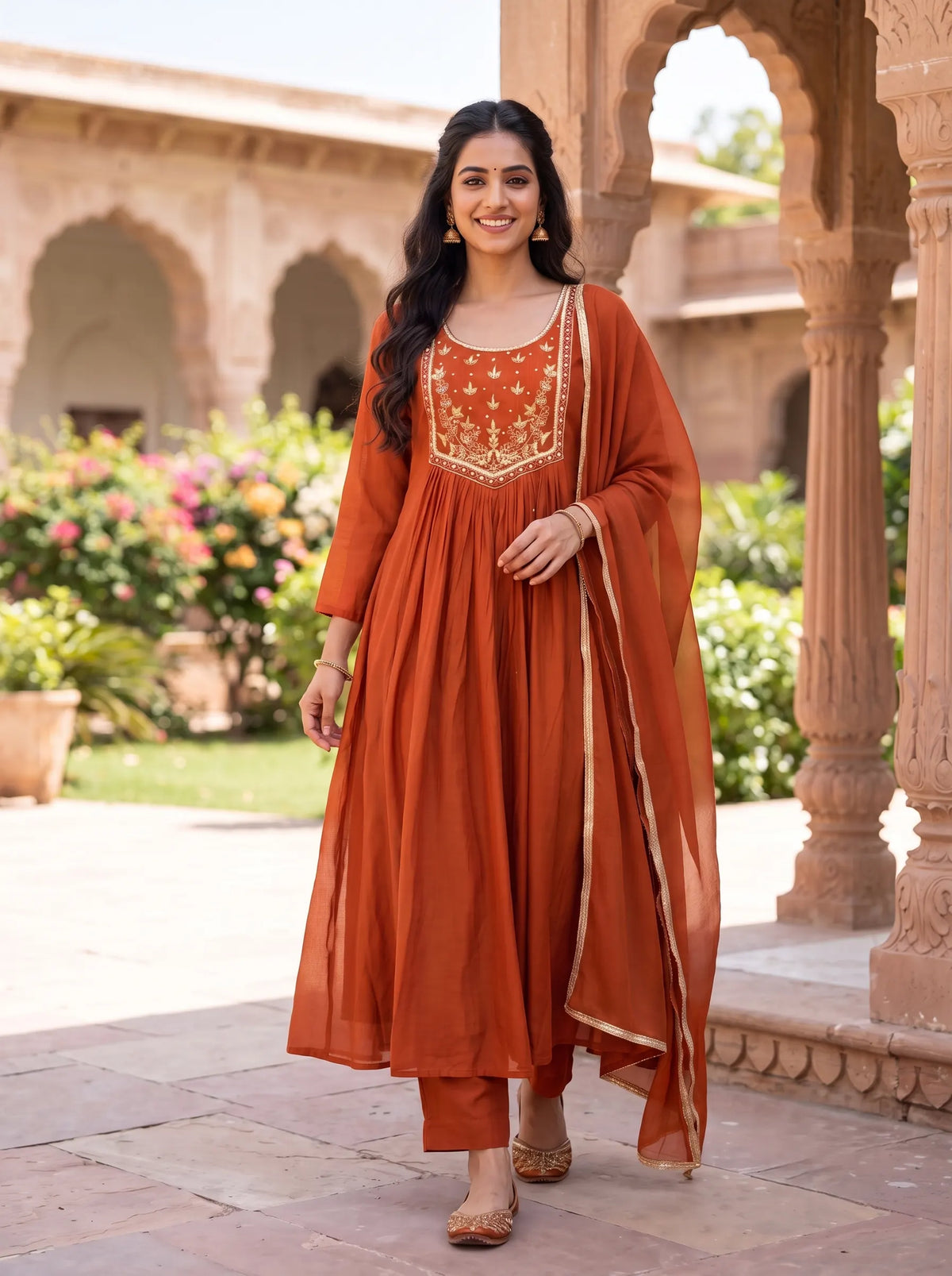 VIBRANT RUST ORANGE ANARKALI SUIT WITH HEAVY GOLD YOKE EMBROIDERY