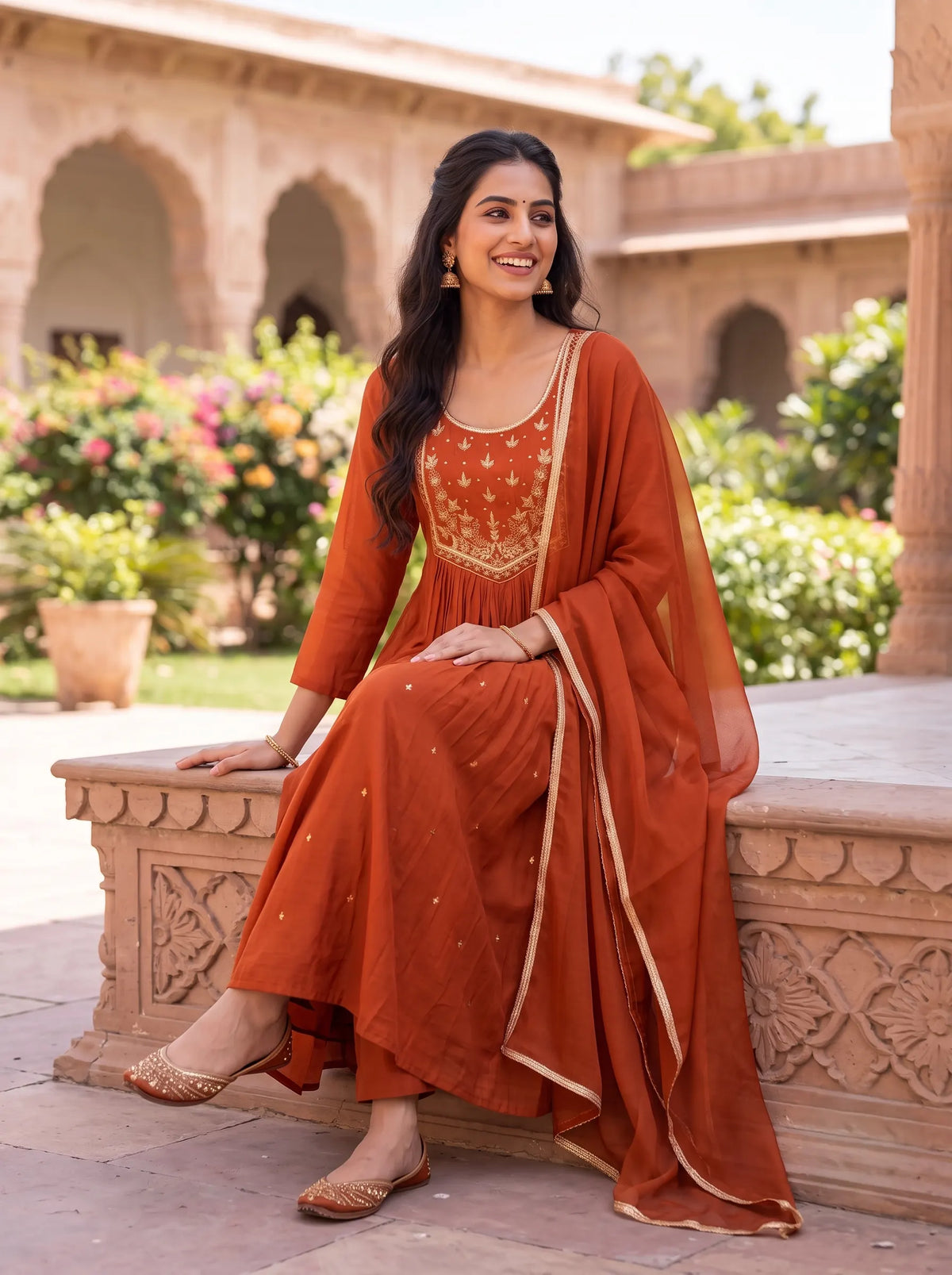 VIBRANT RUST ORANGE ANARKALI SUIT WITH HEAVY GOLD YOKE EMBROIDERY